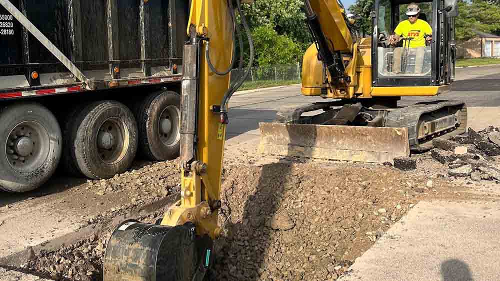 Excavating sewer line in Indianapolis, IN