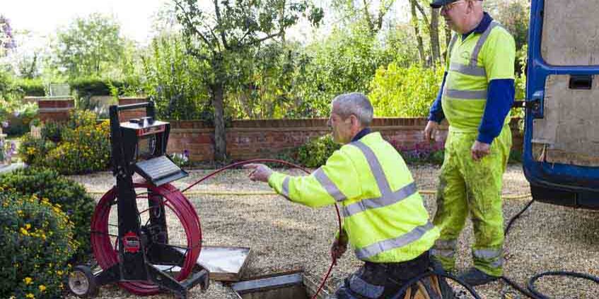 BUCKINGHAM, UK - October 16, 2019. A drain cleaning company checks a blocked drain with a camera prior to jetting